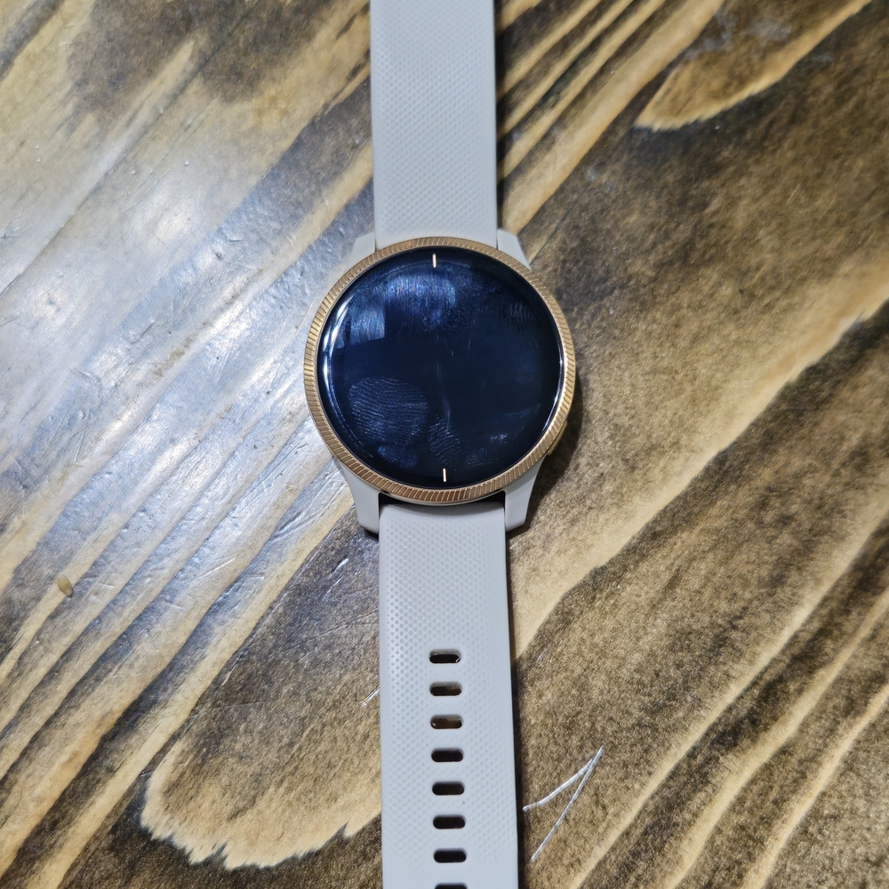 Garmin Venu Smartwatch with Rose Gold Bezel and Cream Band